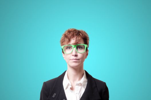 business woman with green eyeglasses on blue background