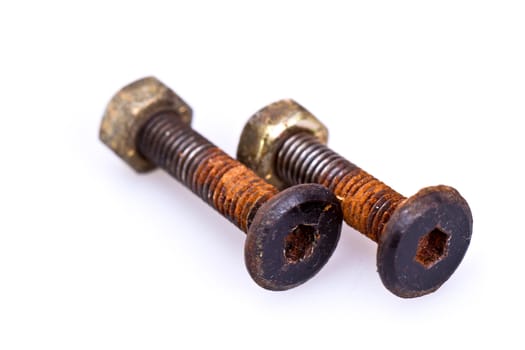 Rusty bolt ad nut on white surface