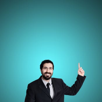 success business man pointing on blue background