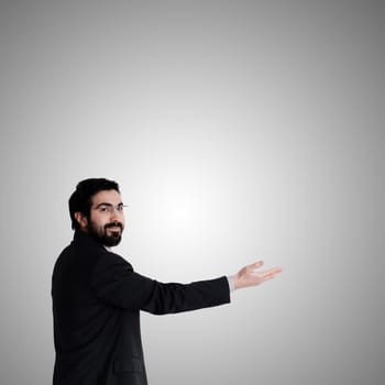 success business man pointing on gray background