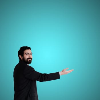 success business man pointing on blue background