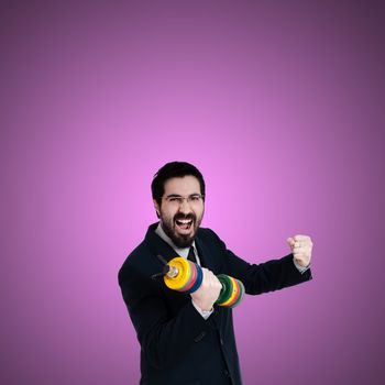 strong business man with weight gym on pink background