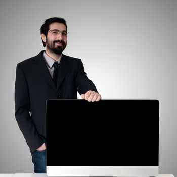 business man and pc monitor on gray background