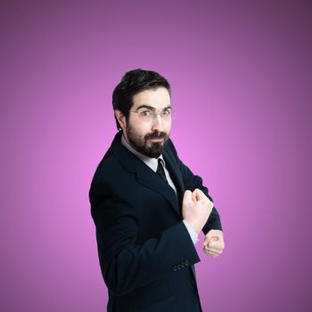 strong business man flexing muscle on pink background
