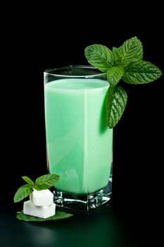 a glass of milk and mint