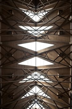 An abstract ceiling made of wood and glass