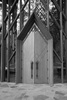 Black and white image of two wooden doors