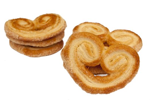 Heart shaped saporelly, sweet puff pastry, isolated over a white background.