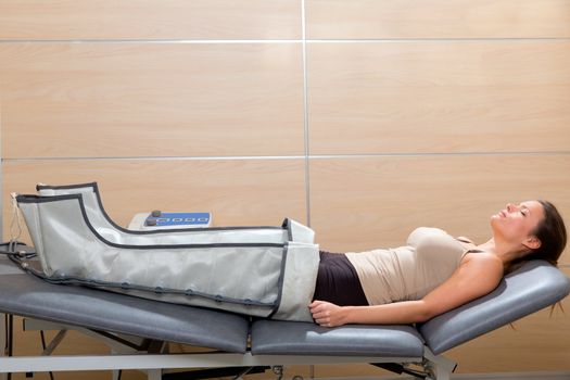 legs pressotherapy machine on woman patient in hospital bed