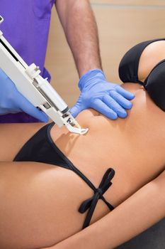 abdominal mesotherapy gun therapy doctor to beautiful woman