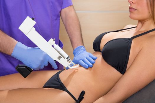 abdominal mesotherapy gun therapy doctor to beautiful woman