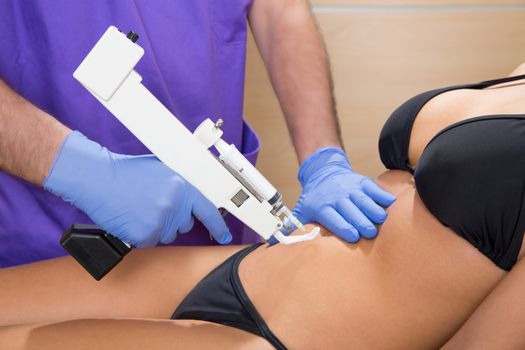 abdominal mesotherapy gun therapy doctor to beautiful woman