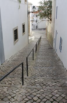 Cobblestoned street in Albufeira, El Algarve, Portugal.