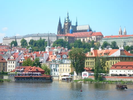 View of Hradcany in Prague, the Castle District surrounding the Prague Castle. The castle is said to be the biggest castle in the world. Its history stretches back to the 9th century. St Vitus Cathedral is located in the castle area.
