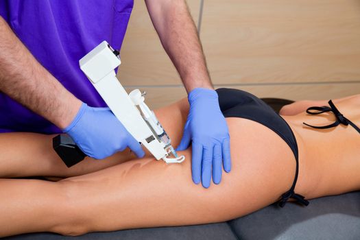 mesotherapy gun therapy for cellulite doctor with woman leg thigh