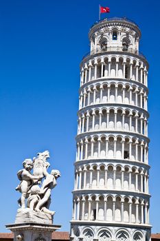 Italy - Pisa. The famous leaning tower on a perfect blue bakcground