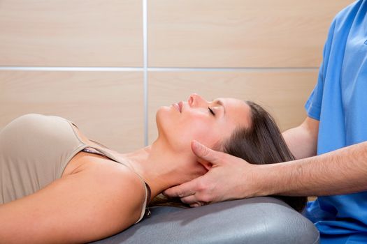 suboccipital massage therapy to woman with doctor therapist hands
