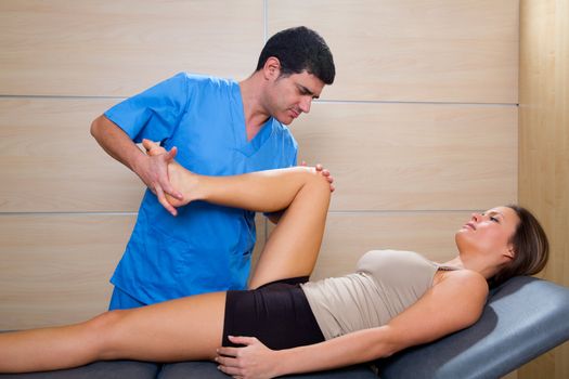 hip mobilization therapy by physiotherapist in hospital to beautiful woman