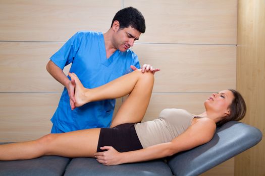 hip mobilization therapy by physiotherapist in hospital to beautiful woman