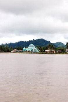 a small mosque on the banks of the river Malinau, Indonesia