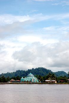 a small mosque on the banks of the river Malinau, Indonesia