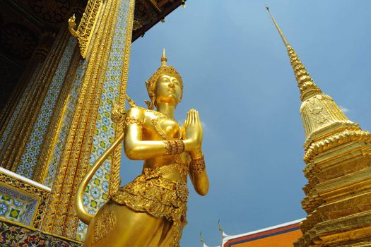 Mythical female bird with a human headache at Emerald Buddha temple in Bangkok,Thailand.