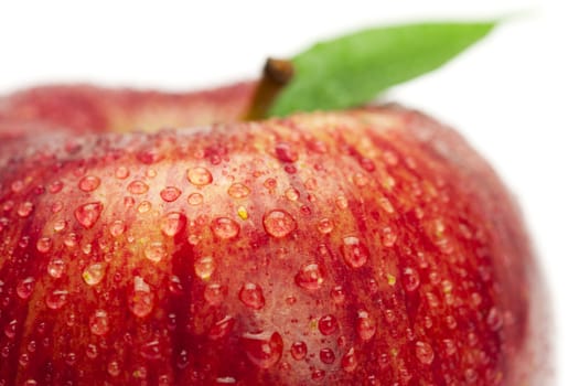 red apples with leaves isolated on white