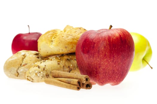 apple, bread and cinnamon isolated on white