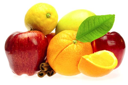 oranges, cinnamon sticks and apples isolated on white