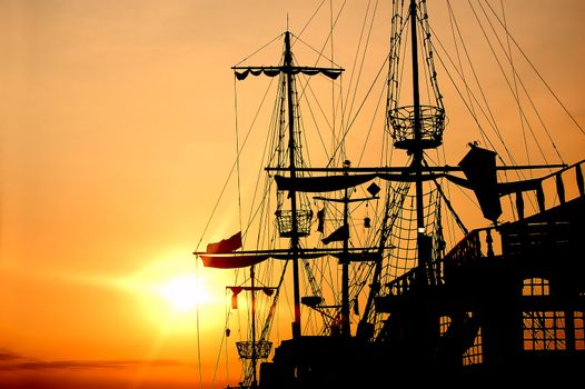 Pirate ship in sunset scenery