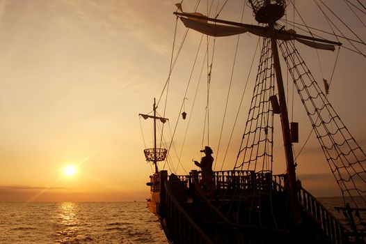 Pirate ship in sunset scenery