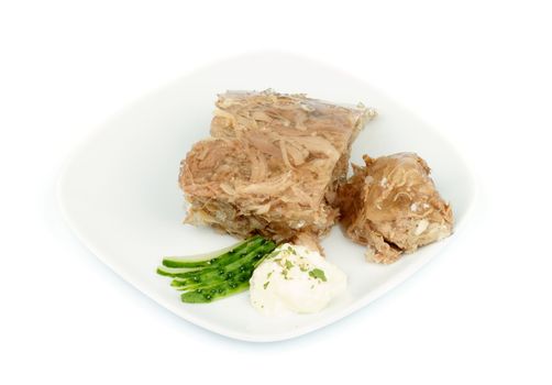 Beef Aspic with Horseradish and Cucumber on White Plate isolated on white background