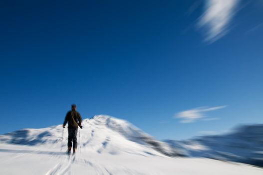 Winter sports - mountain climbing. Motion blurred