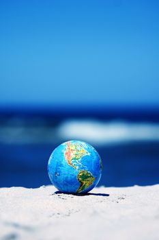 Earth globe on the beach. Ideal for Earth protection concepts, recycling, world issues, enviroment themes