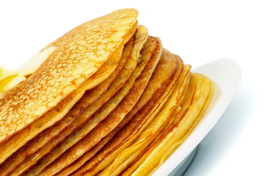 Stack of Delicious Thin Pancakes with Butter on White Plate closeup 