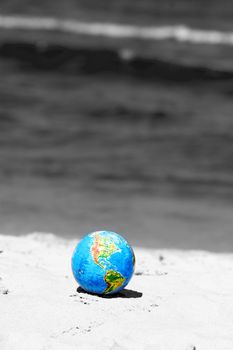 Earth globe on the beach. Ideal for Earth protection concepts, recycling, world issues, enviroment themes