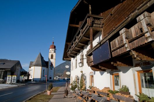 Mountain village in the Alps with traditional buildings