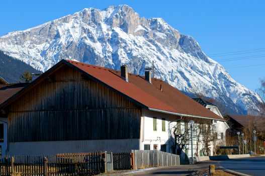 Mountain village in the Alps with traditional buildings