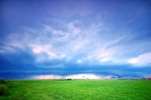Grassland and stormy rainy sky. Ideal as a background