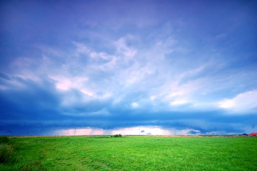 Grassland and stormy rainy sky. Ideal as a background