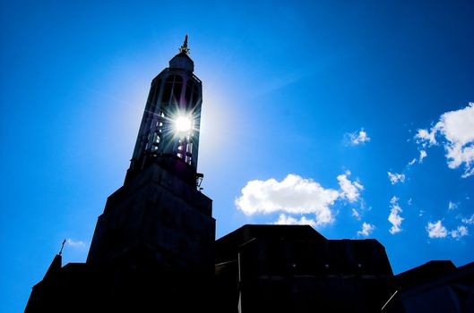 Sun shining through church tower