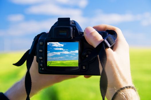 Digital camera capturing beautiful landscape