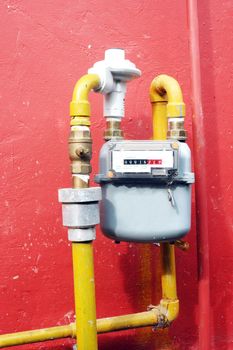 gas meter on the red wall