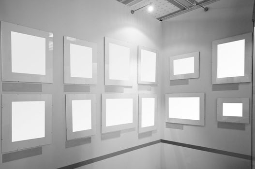 Blank picture frames in art gallery to be filled