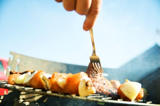 Cooking on the barbecue grill. Outdoor weekend time