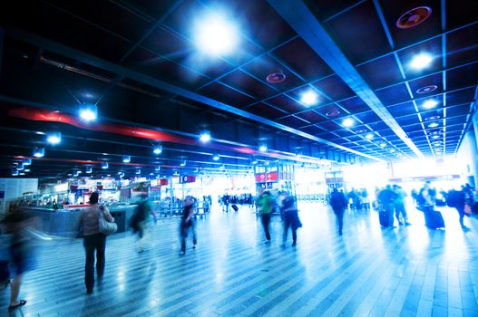 Railway station rush. People motion blur