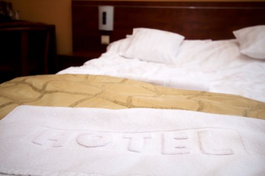 Comfortable hotel room. Bed and hotel towel