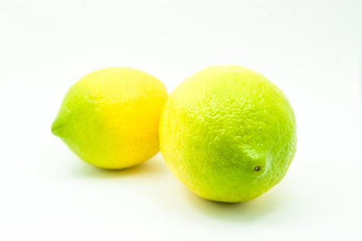Two home grown biological lemons isolated at the studio