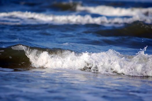 Ocean waves. Focus on wave on the foreground
