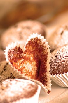 The heart form among the cakes on kitchen table top